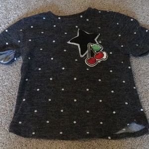 Star cherry shirt with white polka dots.